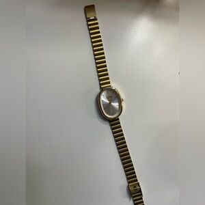 Gold Oval Wristwatch with Silver Dial